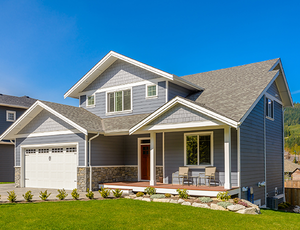 a house with a lawn in front of it.