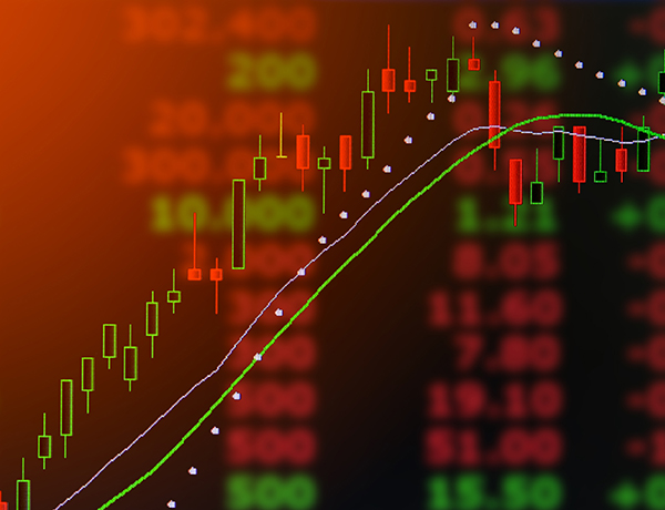 a stock market chart with a green arrow.
